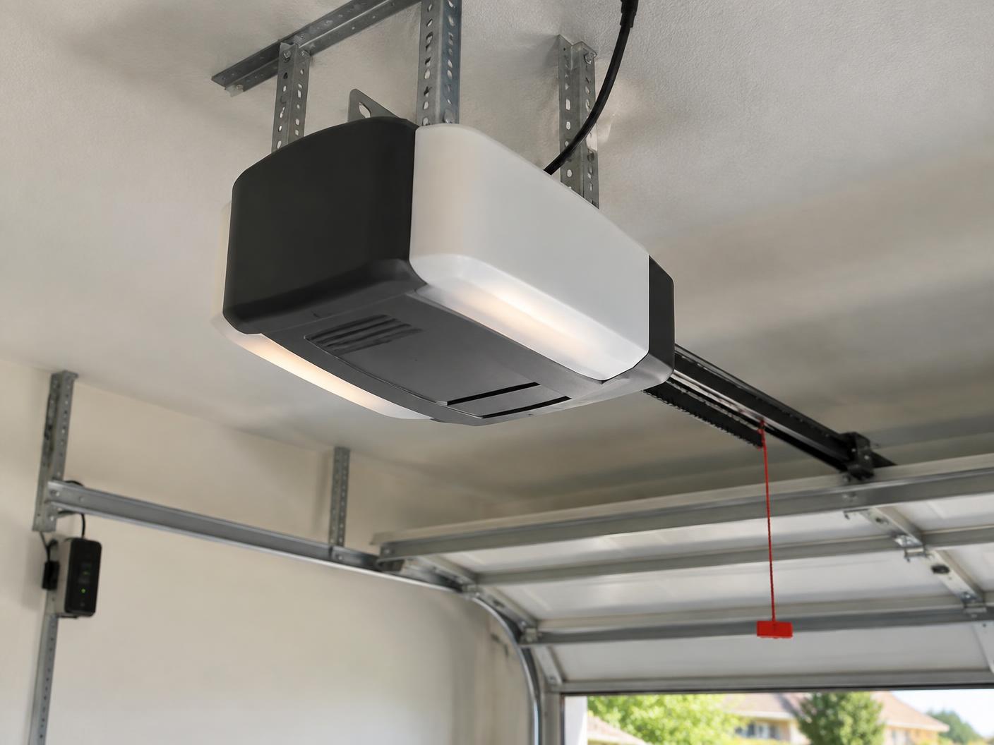 New belt drive garage door opener mounted on a garage ceiling